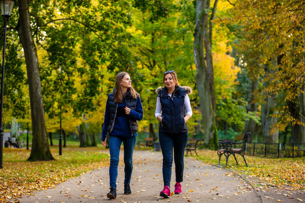 walking-side-by-side-in-a-wooded-area