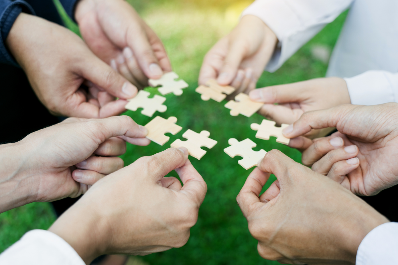 People hands puzzle solving