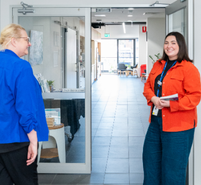 participant attending a Spectrum workshop being welcomed by a staff