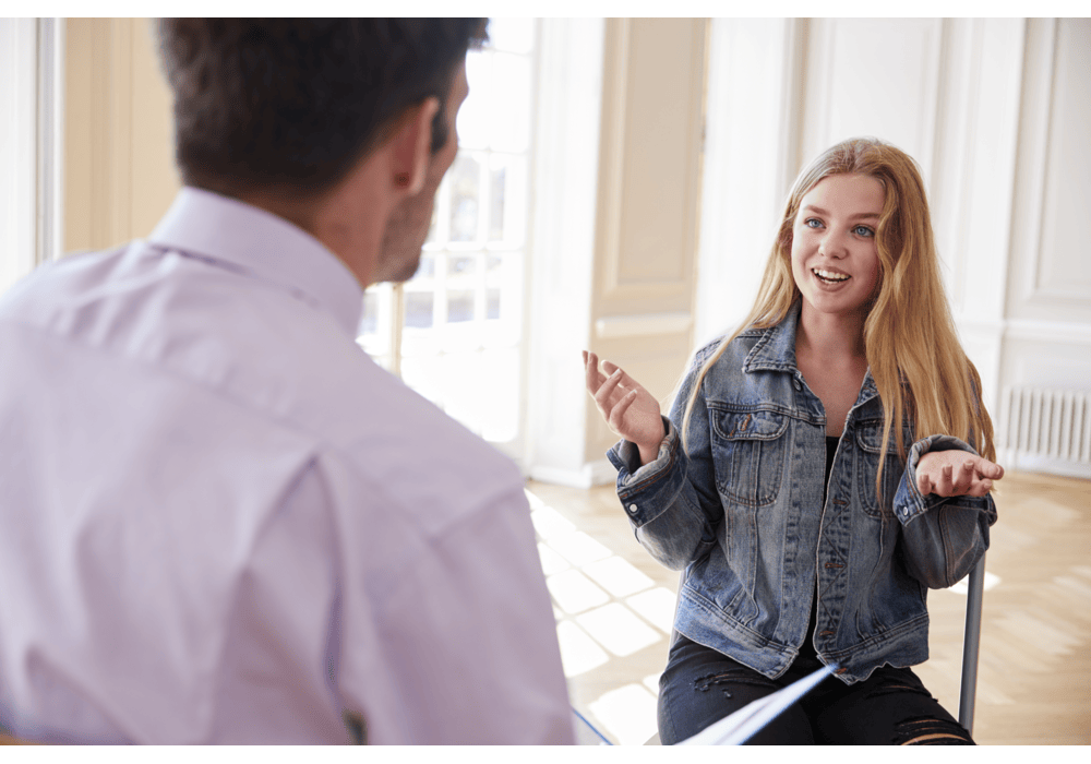 teenage-student-having-discussion-with-tutor teenage-student-having-discussion-with-tutor
