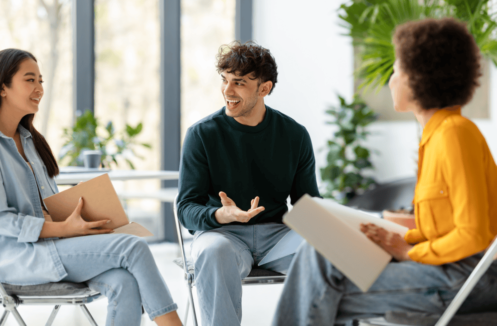 three-diverse-enthusiastic-friends-classmates-plan