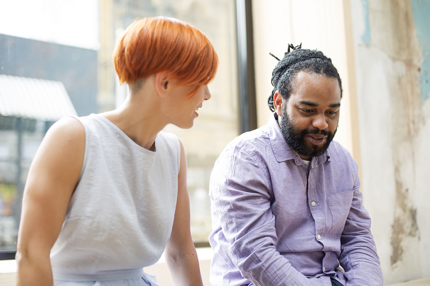Two persons in focused discussion